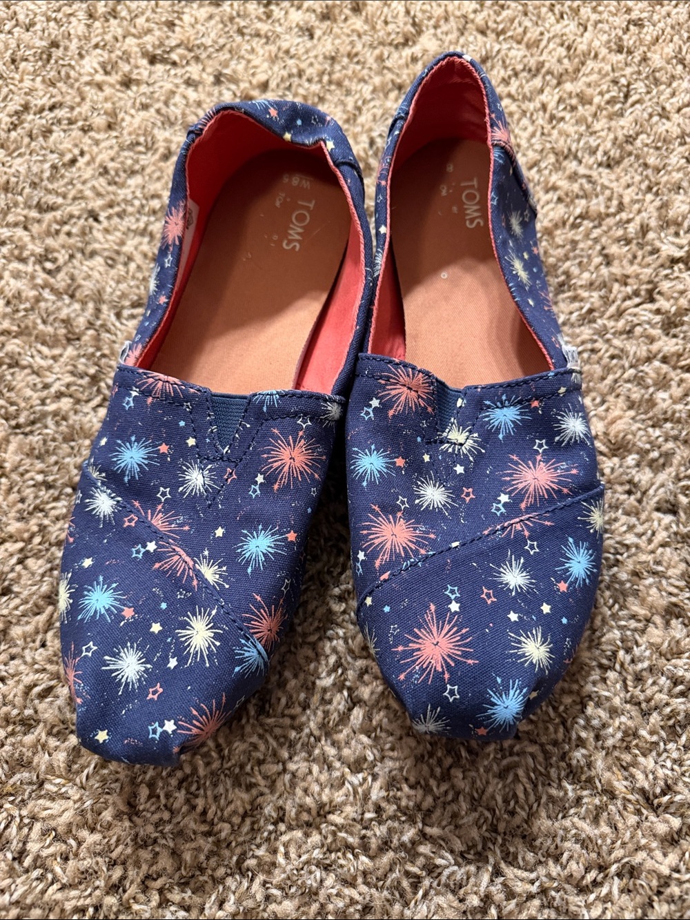 TOMS Navy Canvas Kids Slip-On Shoes with Pink and Light Blue Firework Print